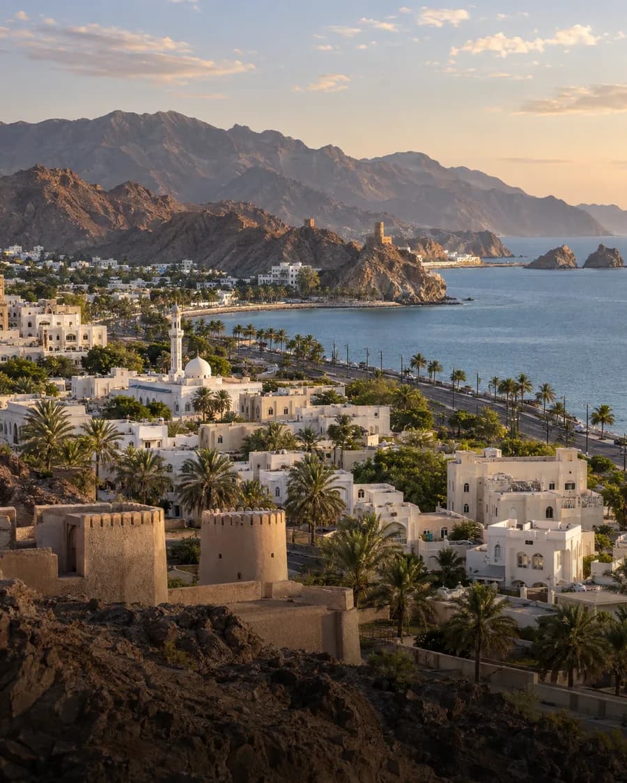 Muscat's white neighborhoods beside the Gulf of Oman and mountains